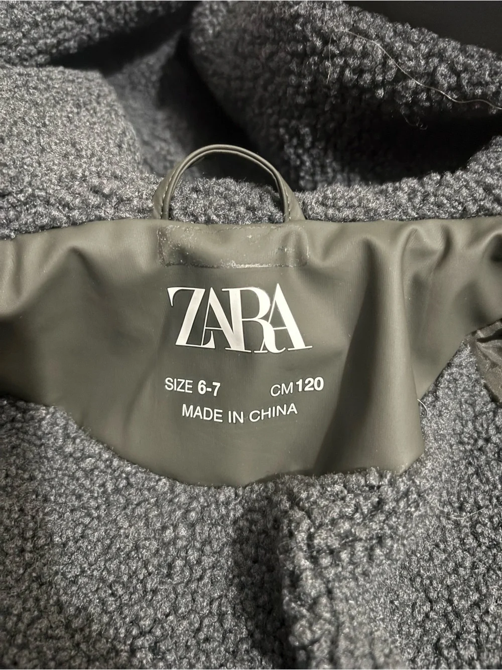 Zara Kids olive green hooded rain jacket with sherpa lining Size 6-7